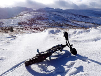Bike on side in snow in lowland hills outside Stirling, Scottland