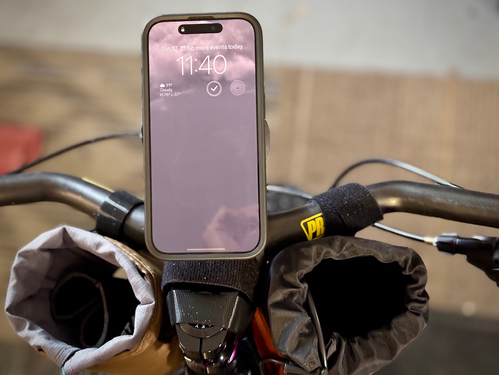 Quad Lock Out Front Pro handlebar mount installed on Bearclaw Bruno fat bike with iPhone in portrait orientation